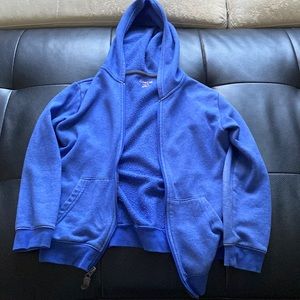 A Cat and Jack jacket that has a zipper and two pockets.